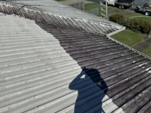 Soft washing a roof in Andergrove Queensland