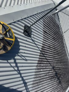 Soft washing process during roof cleaning in West Mackay