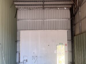 Clean industrial shed wall after pressure cleaning Mackay