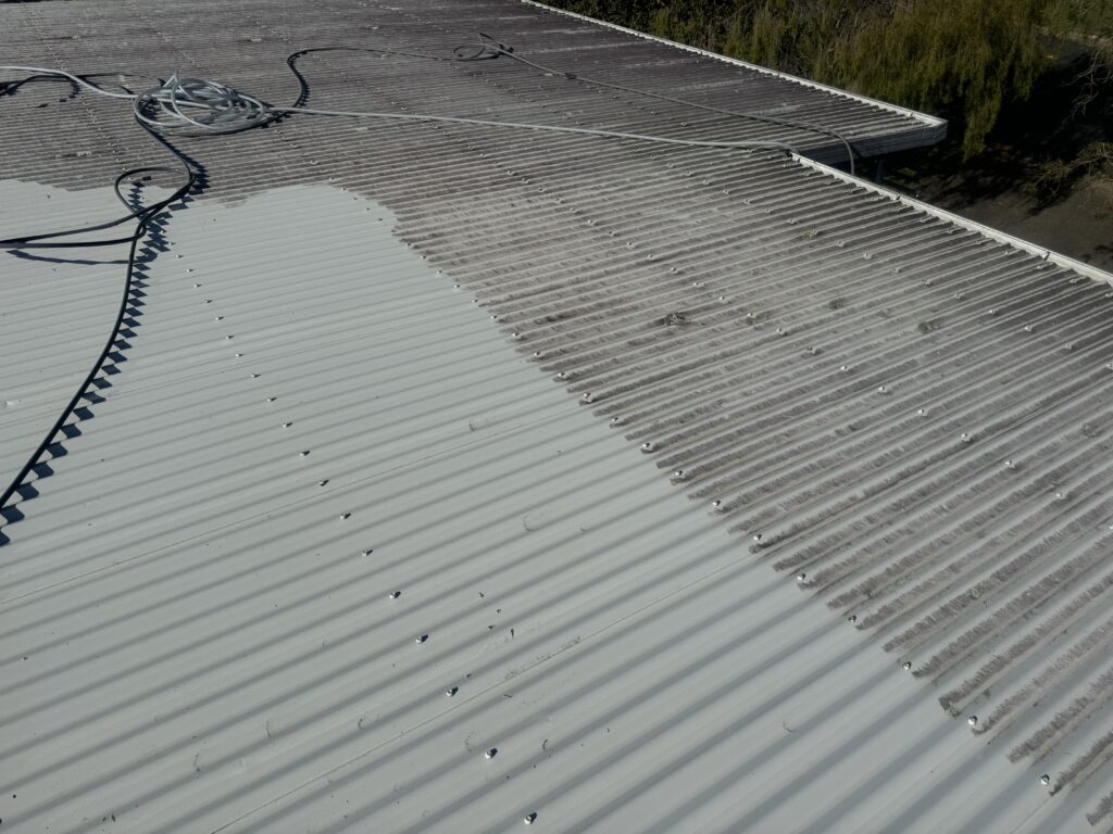Dirty colourbond roof in Glenella