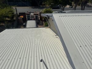 Clean white Colorbond roof after roof cleaning in Slade Point