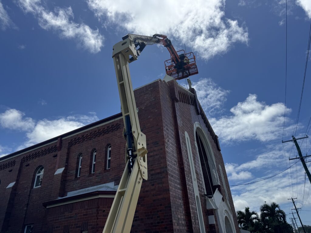 Commercial church cleaning Mackay using elevated work platform