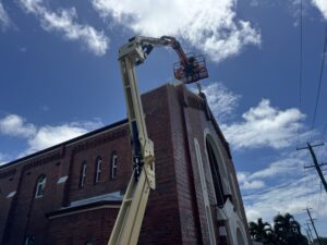 Commercial church cleaning Mackay using elevated work platform