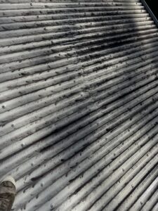 Heavy mould on white Colorbond roof before roof cleaning in North Mackay