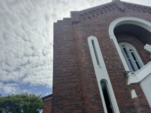 Before church cleaning showing mould and staining on brickwork in Mackay