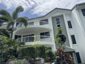 Clean rendered apartment building after soft washing in Mackay