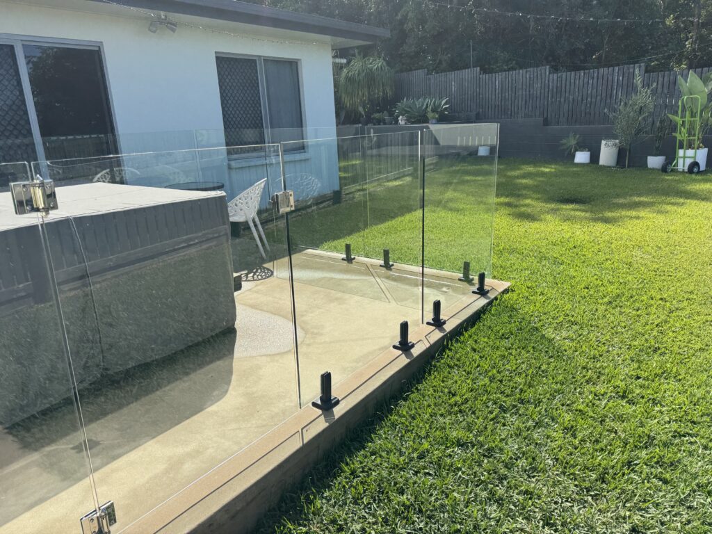 Professional glass cleaning of outdoor glass fence panels in Glenella Mackay