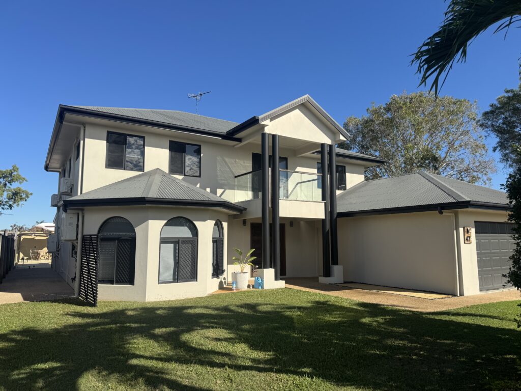 Exterior cleaning completed on a large two-storey home in Glenella Mackay by Pristine Washing