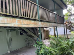  Dirty balcony and exterior walls before house washing in Andergrove