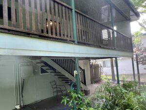  Soft washing process removing mould from balcony in Andergrove