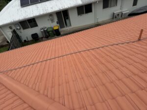 Clean terracotta tile roof after professional roof cleaning in Glenella