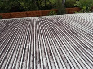Dirty painted roof in Andergrove