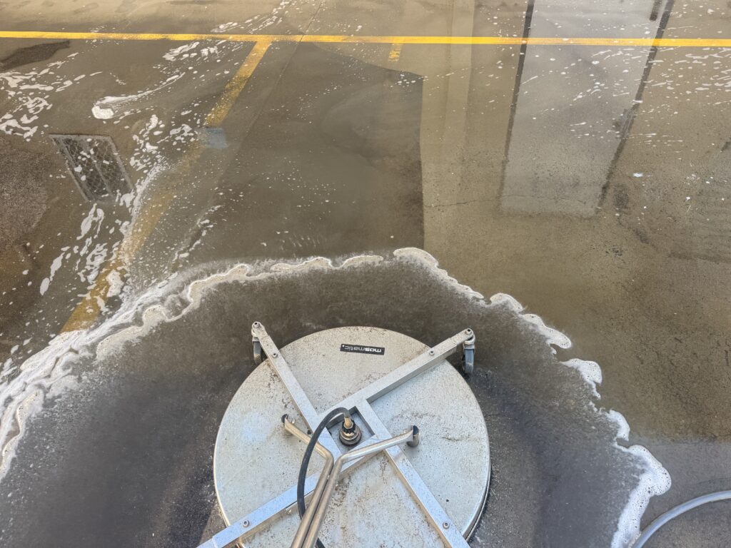Commercial surface cleaner restoring a concrete driveway in Mackay