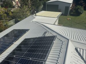 Roof washing around solar panels West Mackay
