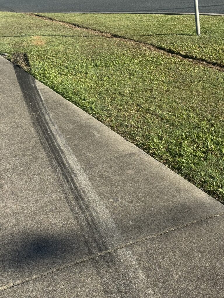 Pressure cleaning tyre marks from driveway in Mackay