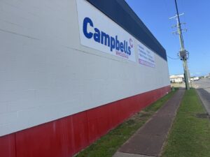 Clean exterior wall at Campbell’s Wholesale after commercial building washing in Mackay