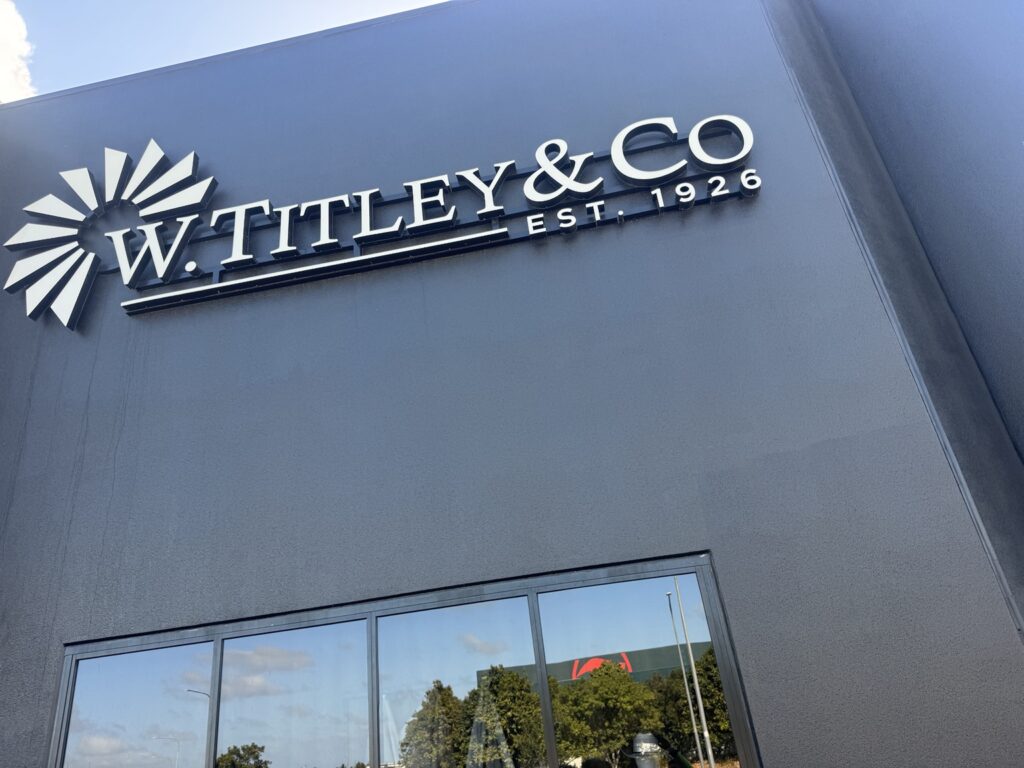 Shopfront cleaning Mackay at the dark painted W. Titley & Co building